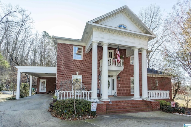 greek revival house with a carport