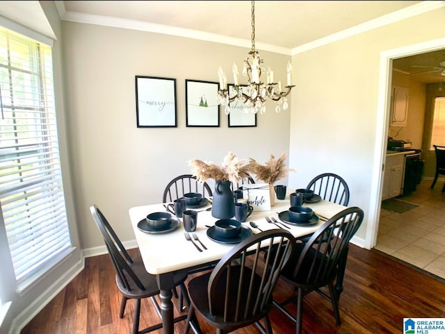 dining space with a chandelier, dark hardwood / wood-style floors, and crown molding