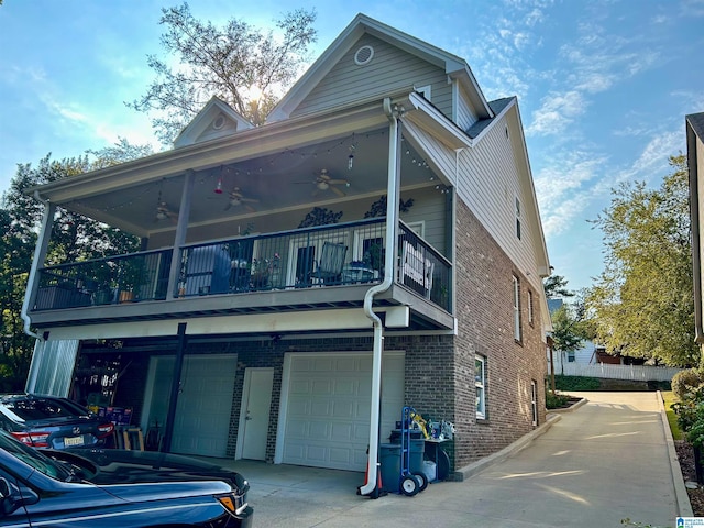 exterior space with a garage and a balcony