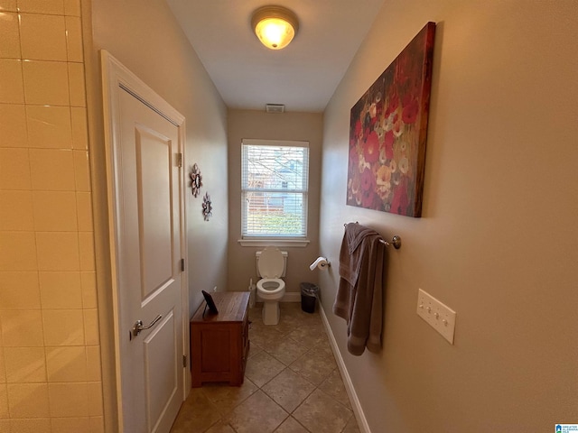 bathroom featuring tile patterned floors and toilet