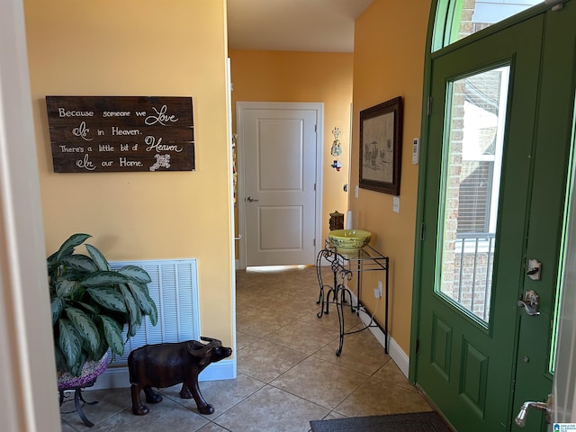 entryway with light tile patterned floors