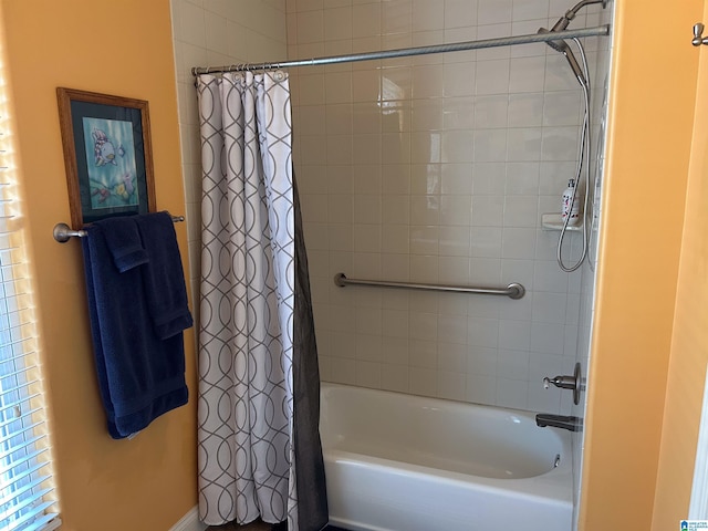 bathroom featuring shower / bath combo with shower curtain