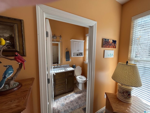 bathroom with vanity and toilet