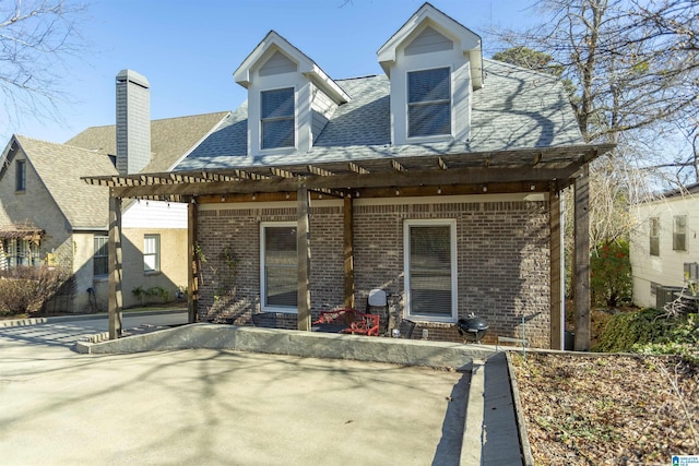 back of house featuring a pergola and a patio