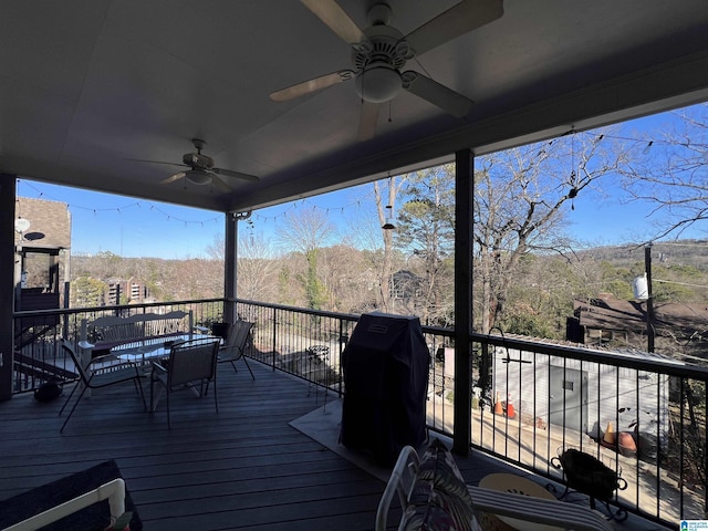 wooden terrace featuring a mountain view, area for grilling, and ceiling fan