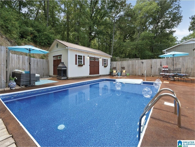 view of swimming pool with an outbuilding