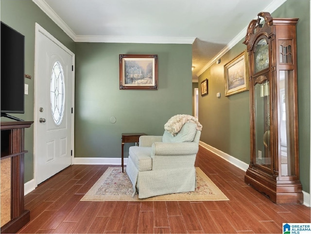 foyer entrance with crown molding and dark hardwood / wood-style floors