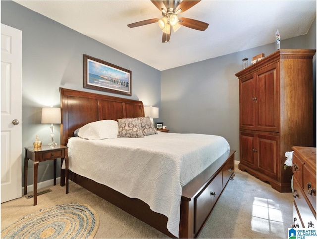 carpeted bedroom with ceiling fan