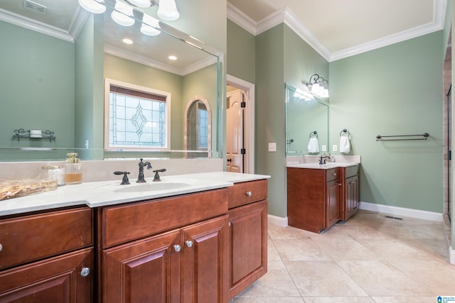 bathroom with tile patterned floors, crown molding, and vanity