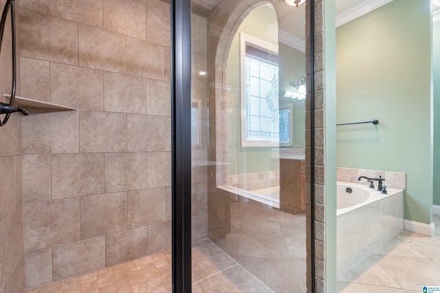 bathroom with tile patterned floors, separate shower and tub, and crown molding