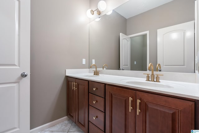 bathroom with tile patterned flooring and vanity