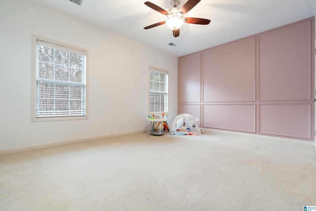 recreation room featuring carpet and ceiling fan