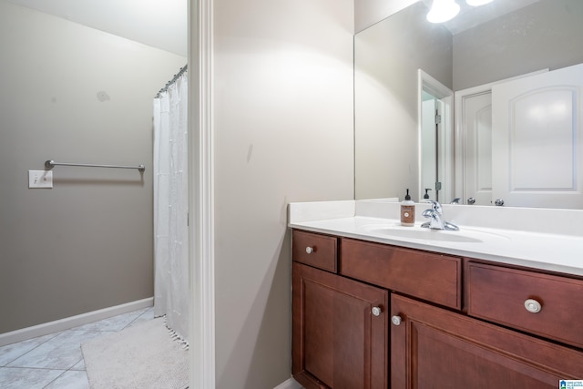 bathroom featuring a shower with curtain, tile patterned flooring, and vanity