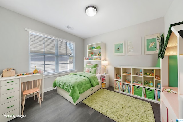 bedroom featuring hardwood / wood-style floors