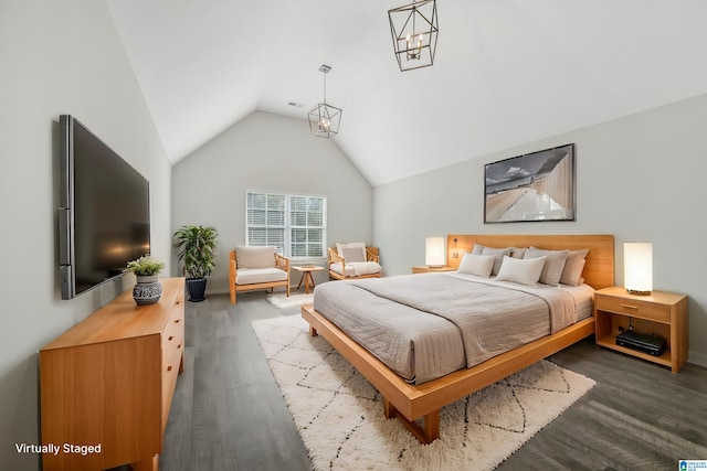 bedroom with vaulted ceiling and dark wood-type flooring