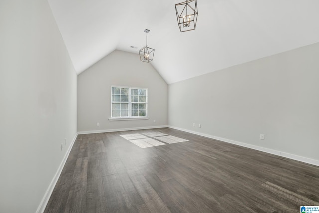 interior space with dark hardwood / wood-style flooring and vaulted ceiling