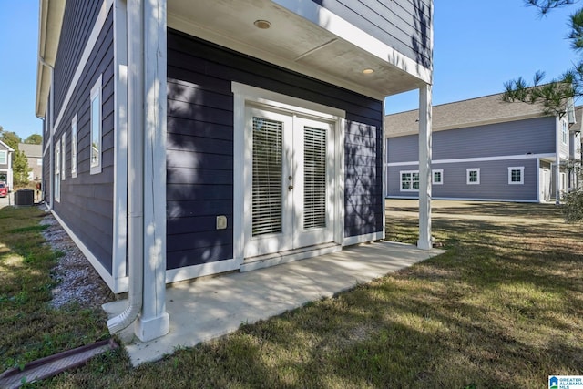 exterior space featuring a lawn and cooling unit