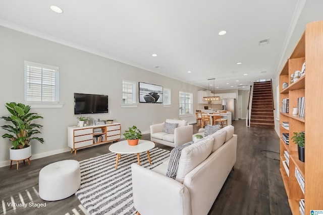 living room with ornamental molding and dark wood-type flooring