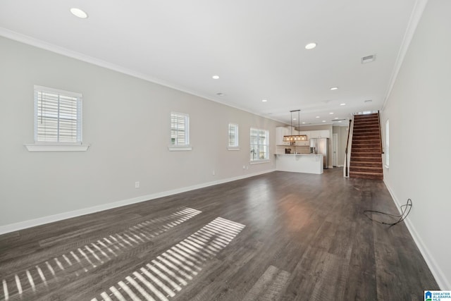 unfurnished living room with dark hardwood / wood-style floors and ornamental molding