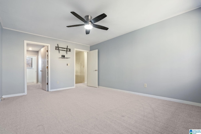 unfurnished bedroom with light colored carpet, ceiling fan, and ornamental molding