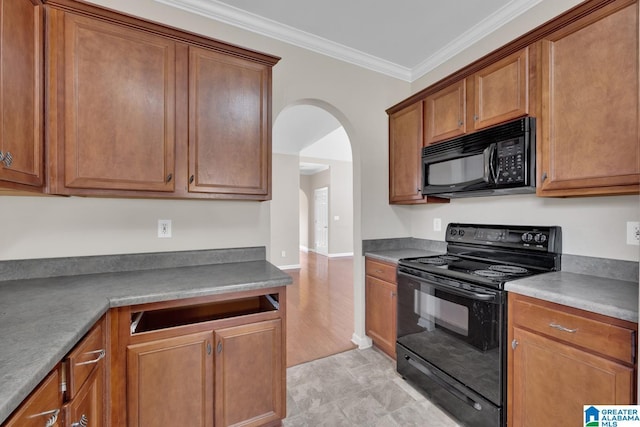 kitchen featuring black appliances and ornamental molding