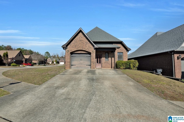 view of front facade with a garage and a front lawn