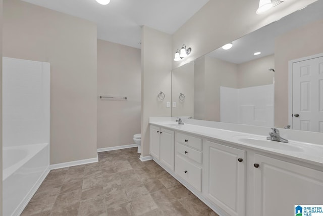 bathroom featuring vanity and toilet