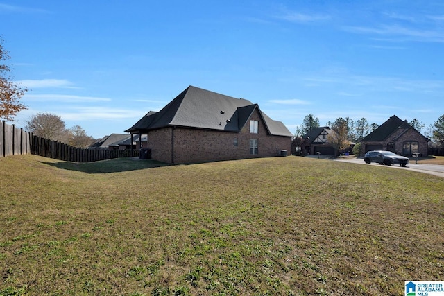 view of property exterior with a lawn