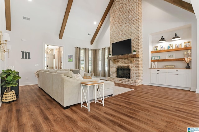 living room with beamed ceiling, a fireplace, high vaulted ceiling, and dark wood-type flooring