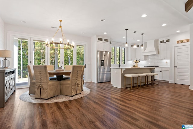 dining room featuring a chandelier and dark hardwood / wood-style floors