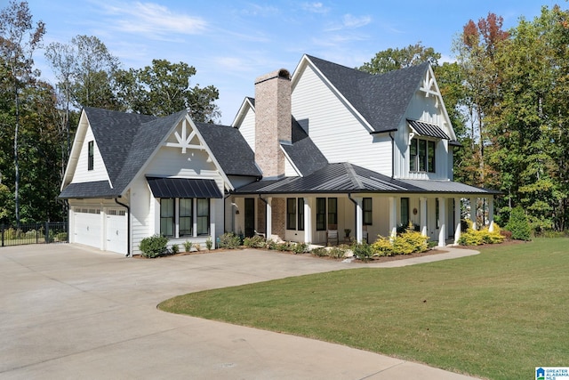 modern farmhouse style home with a porch, a garage, and a front lawn