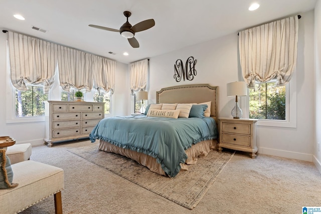 bedroom with light carpet and ceiling fan