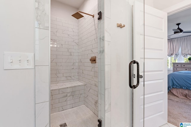 bathroom featuring walk in shower and ceiling fan