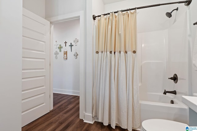 bathroom featuring wood-type flooring, toilet, and shower / bath combination with curtain