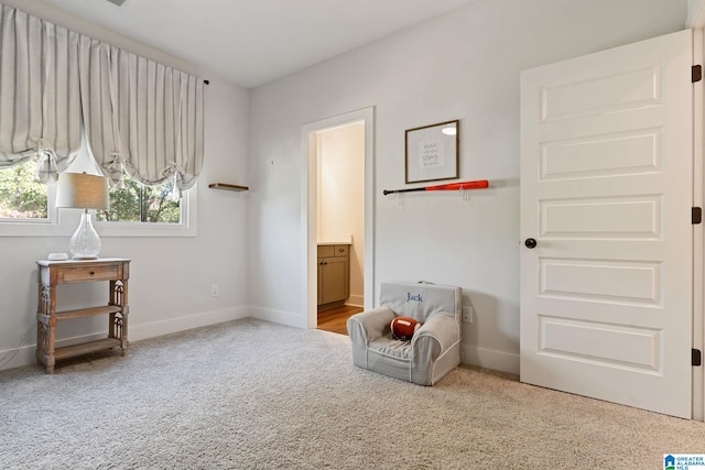 living area with carpet flooring