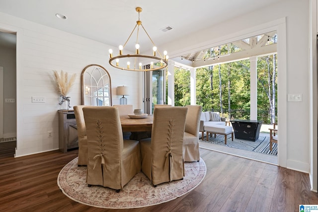 dining room featuring a chandelier and hardwood / wood-style flooring