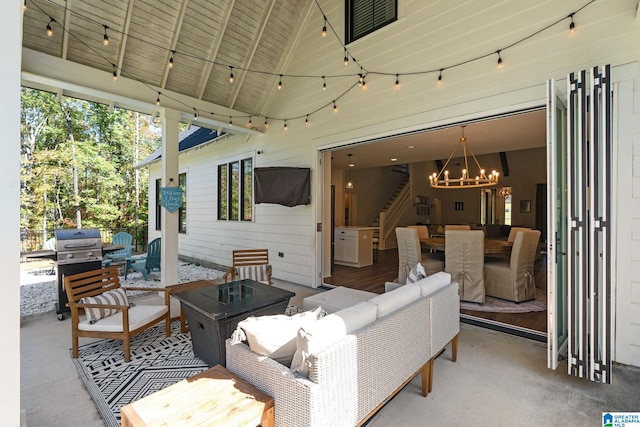 view of patio with an outdoor living space and a grill