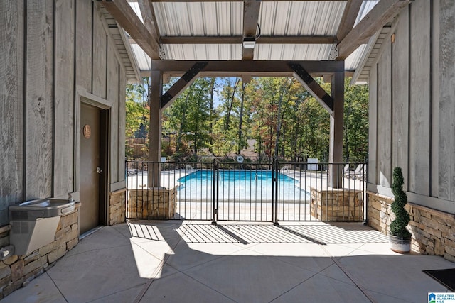 view of patio / terrace with a fenced in pool