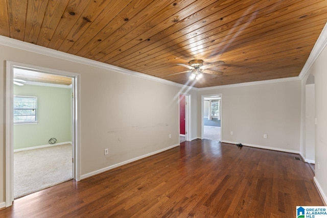 spare room with dark hardwood / wood-style flooring, ceiling fan, and crown molding