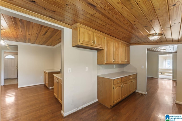 kitchen with dark wood-type flooring, wooden ceiling, and ornamental molding