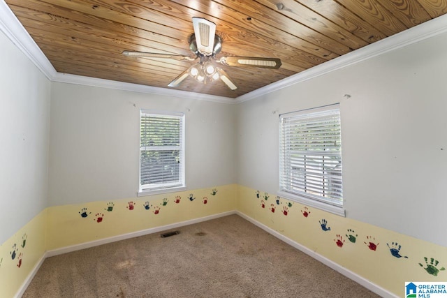 carpeted empty room featuring crown molding, plenty of natural light, and ceiling fan