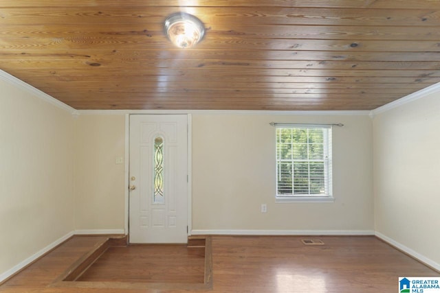 foyer featuring wood-type flooring, ornamental molding, and wooden ceiling