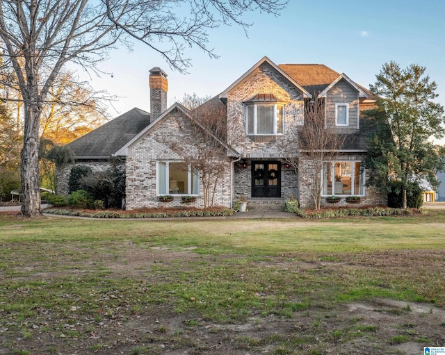 craftsman inspired home with french doors and a front lawn