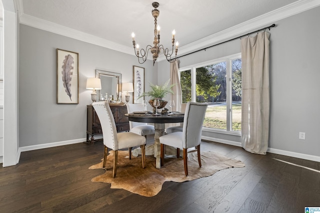 dining area with dark hardwood / wood-style flooring, ornamental molding, and a chandelier