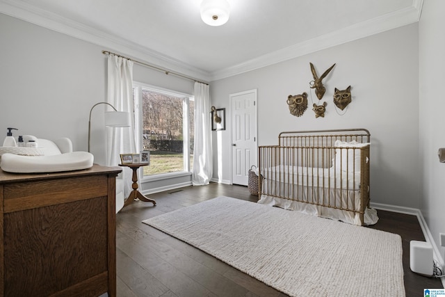 bedroom featuring dark hardwood / wood-style floors and crown molding