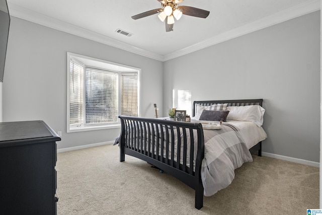 bedroom with light carpet, ceiling fan, and crown molding