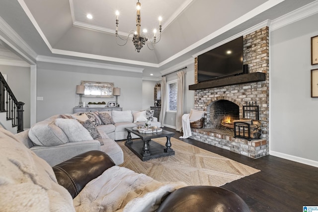 living room featuring hardwood / wood-style flooring, a notable chandelier, and crown molding