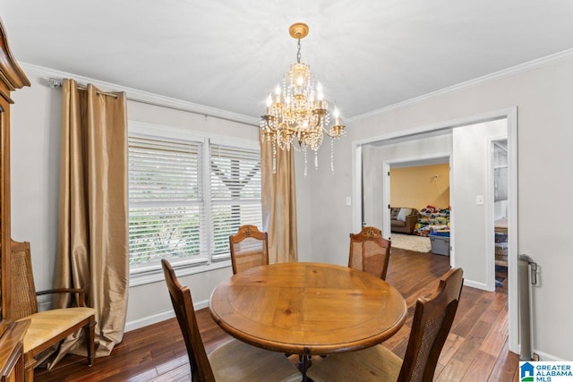 dining room with a chandelier, dark hardwood / wood-style flooring, and ornamental molding