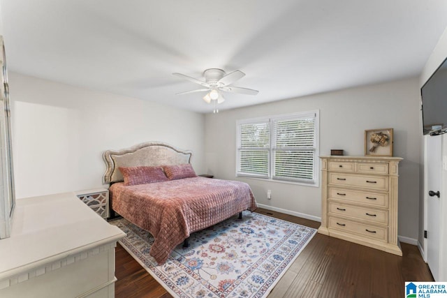 bedroom featuring ceiling fan and dark wood-type flooring