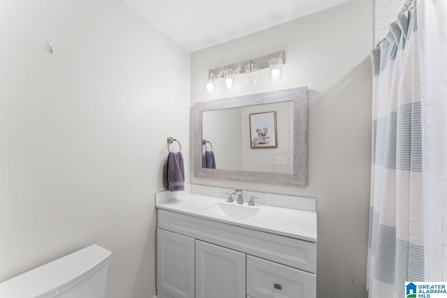 bathroom with vanity and toilet